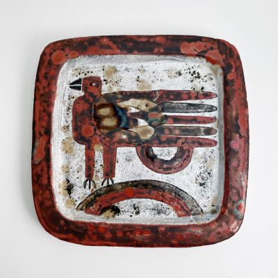 A pair of rectangular ceramic plates with a bird, signed._0