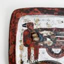 A pair of rectangular ceramic plates with a bird, signed._3